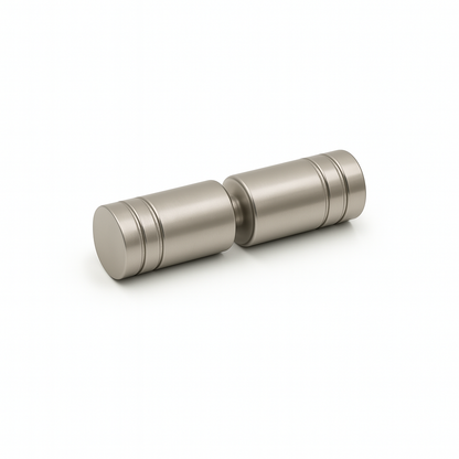 Pair of metallic salt and pepper shakers on a white background